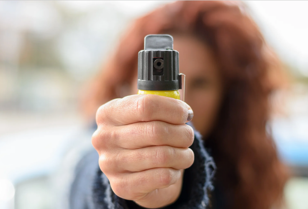 image of a woman testing pepper spray effectiveness 